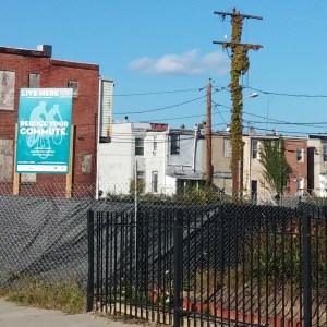Live Here Reduce Your Commute Sign at 20th & Guilford