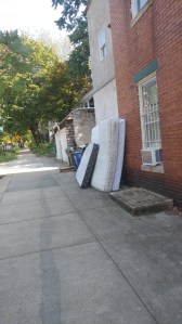 Abandoned Mattresses Against a House at 32nd & Calvert