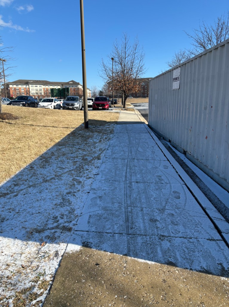 A Little Snow on the Sidewalk Behind the Waverly YMCA.